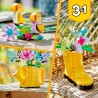 Gießkanne mit Blumen