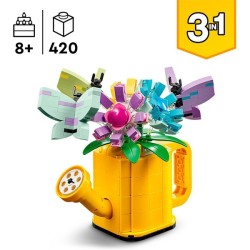Gießkanne mit Blumen