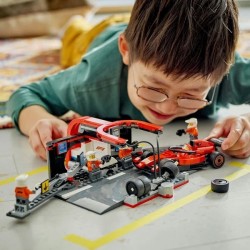 F1 Boxenstopp mit Boxencrew und Ferrari Flitzer